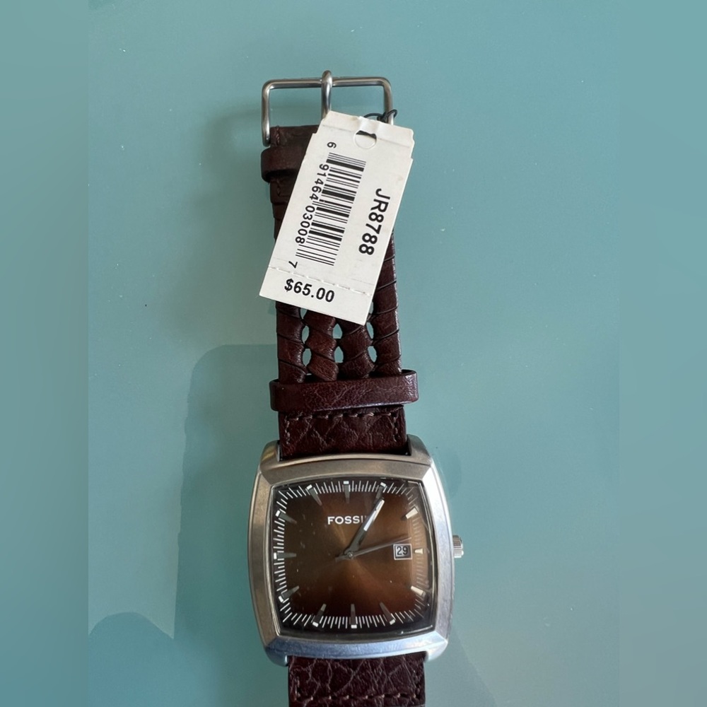 Fósil Watch. Brand new. Has small scratch on the back